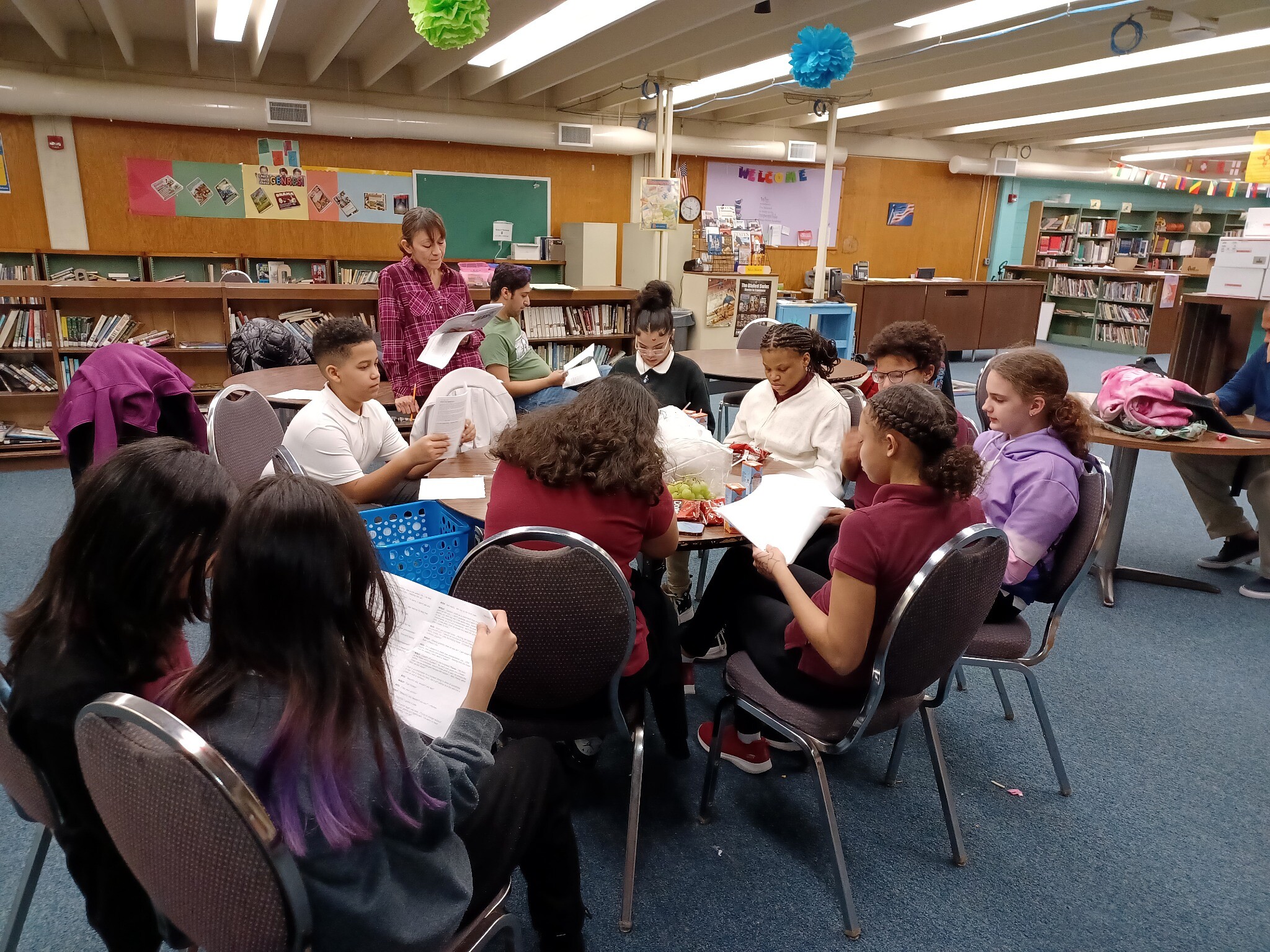 Students seated in a circle participating in a theatre activity at Raub Elementary School